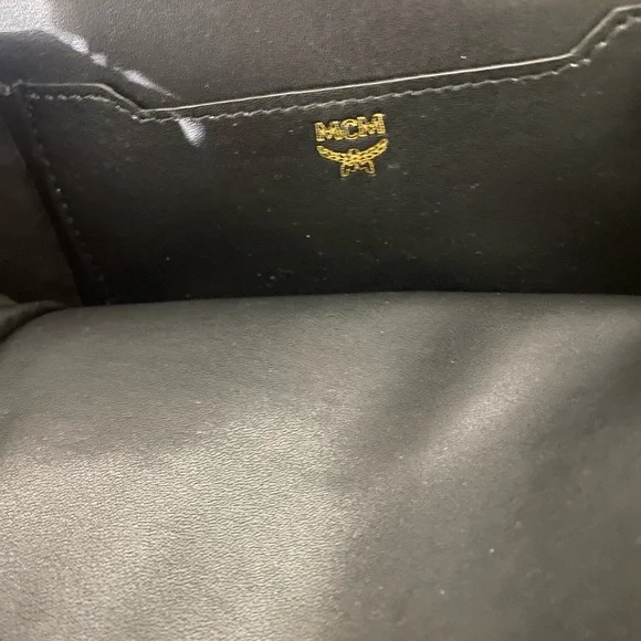 MCM small Cognac back pack with storage bag.